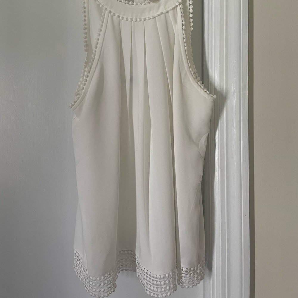White blouse with bow tie in back